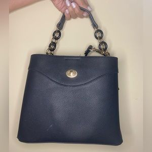 Small black purse with cross strings. Slightly used.